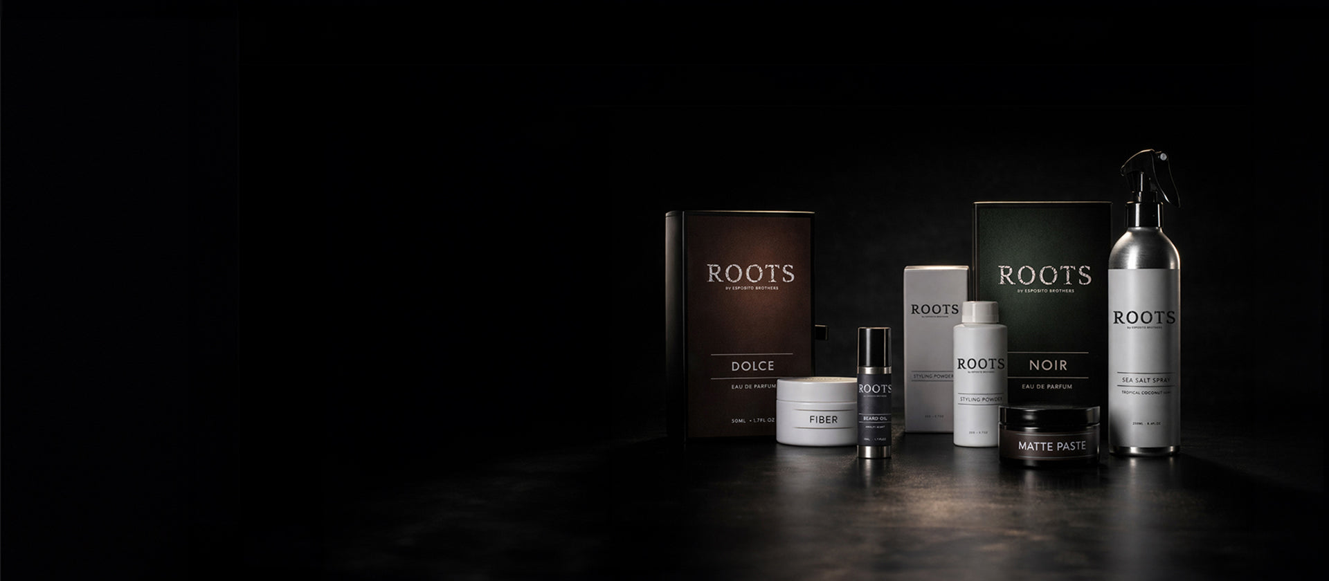 Collection of Roots grooming products on a dark background